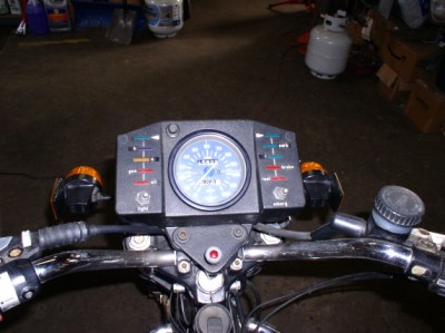 Knob below the speedo is for the rear red fog light (required in the UK). 