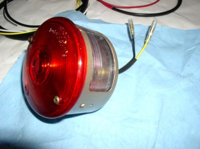 Taillight reassembled with new gaskets and wiring. Need new screws for the lens yet. 